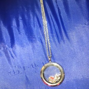 A silver necklace with country related charms.